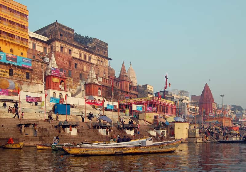Boats and bathers at Ahilyabai Ghat in the cool morning light