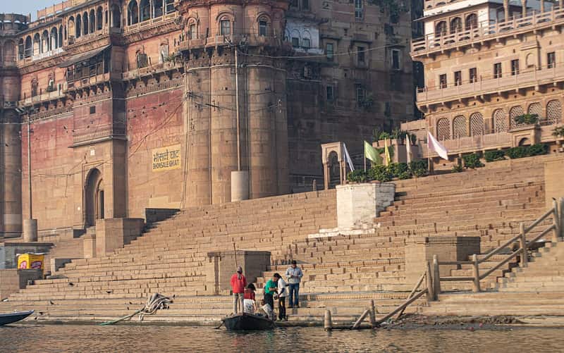 The weathered Bhonsale palace rising above the ghat steps