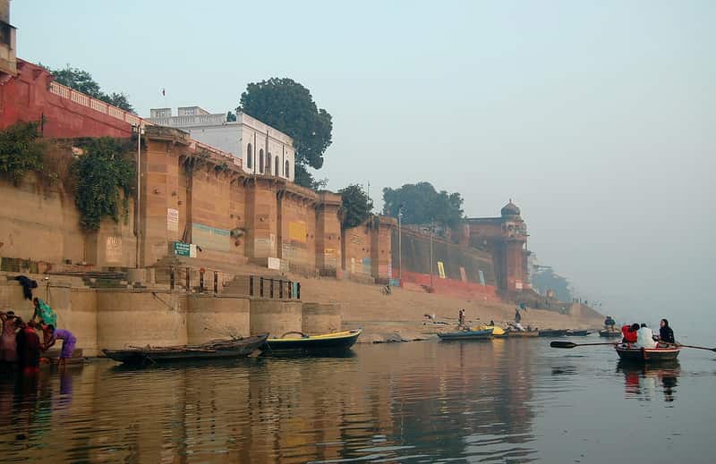 A pilgrim praying at the water's edge