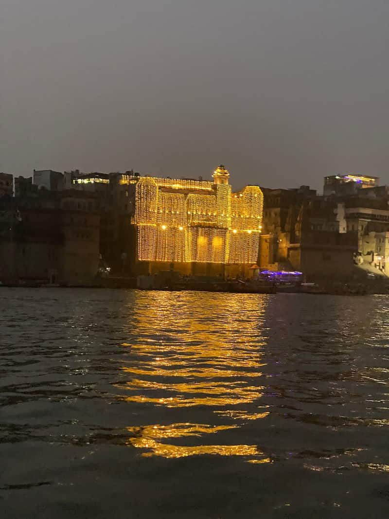 Bathers on the broad steps of Darbhanga Ghat at sunrise