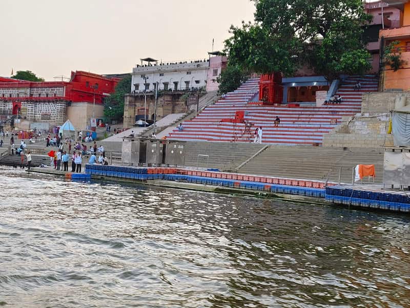 Steps of Gularia Ghat meeting the water of the Ganga in soft morning light