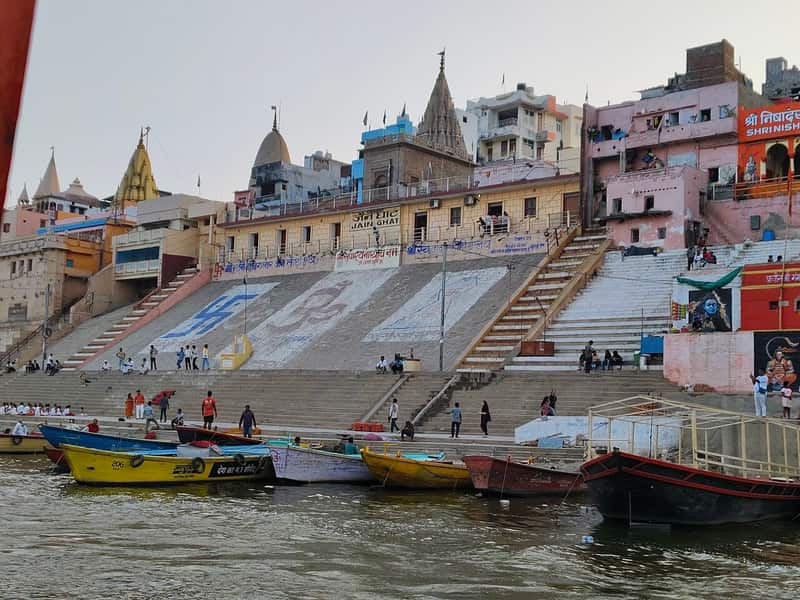 Jain pilgrims bathing at dawn on the ghat steps
