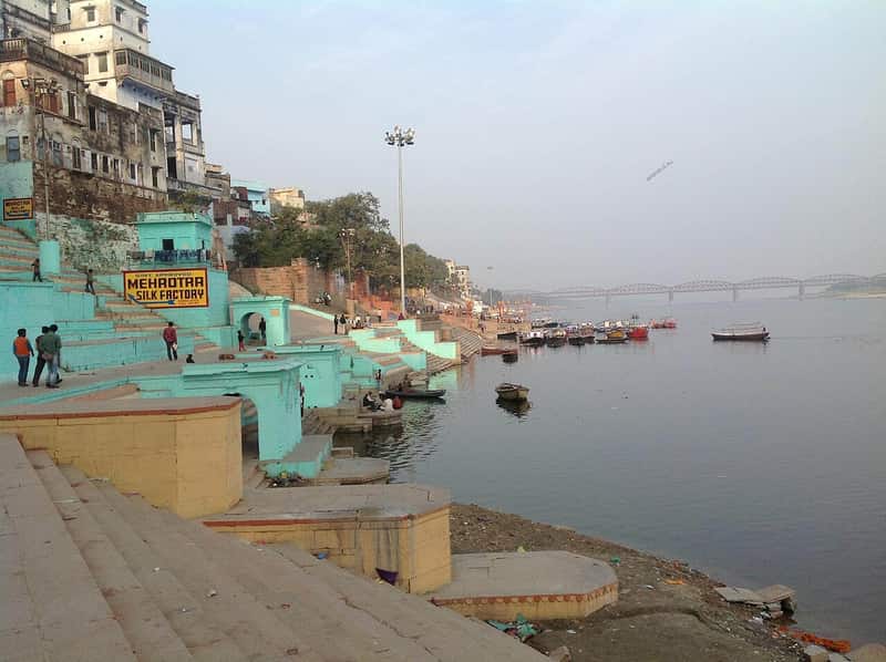 Stone steps of Lal Ghat leading down to the wide Ganga