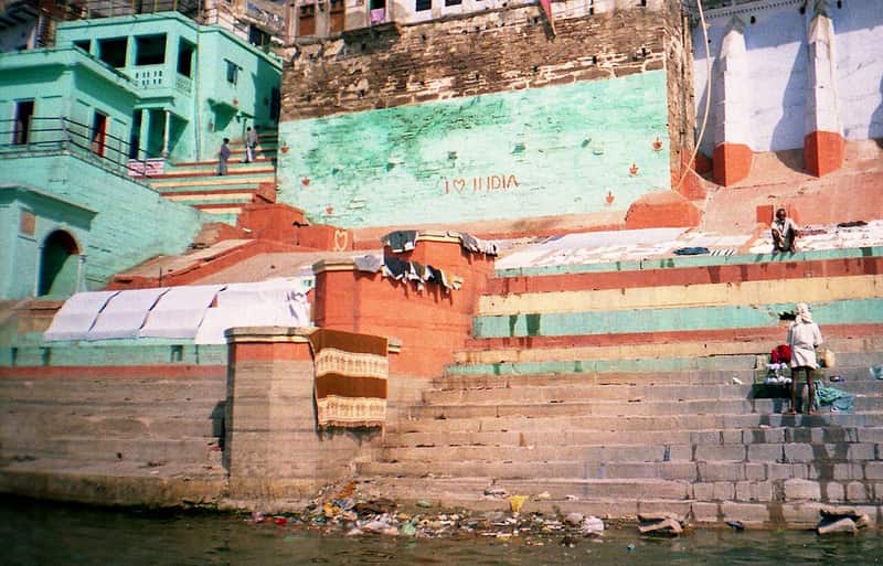 Boatmen resting beside their wooden boats at Lal Ghat