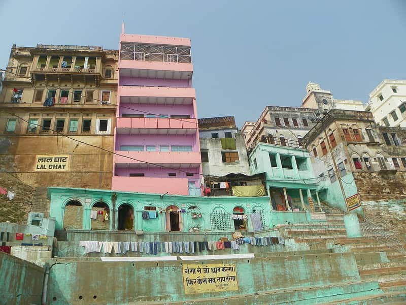A small shrine with marigold garlands near the steps of Lal Ghat