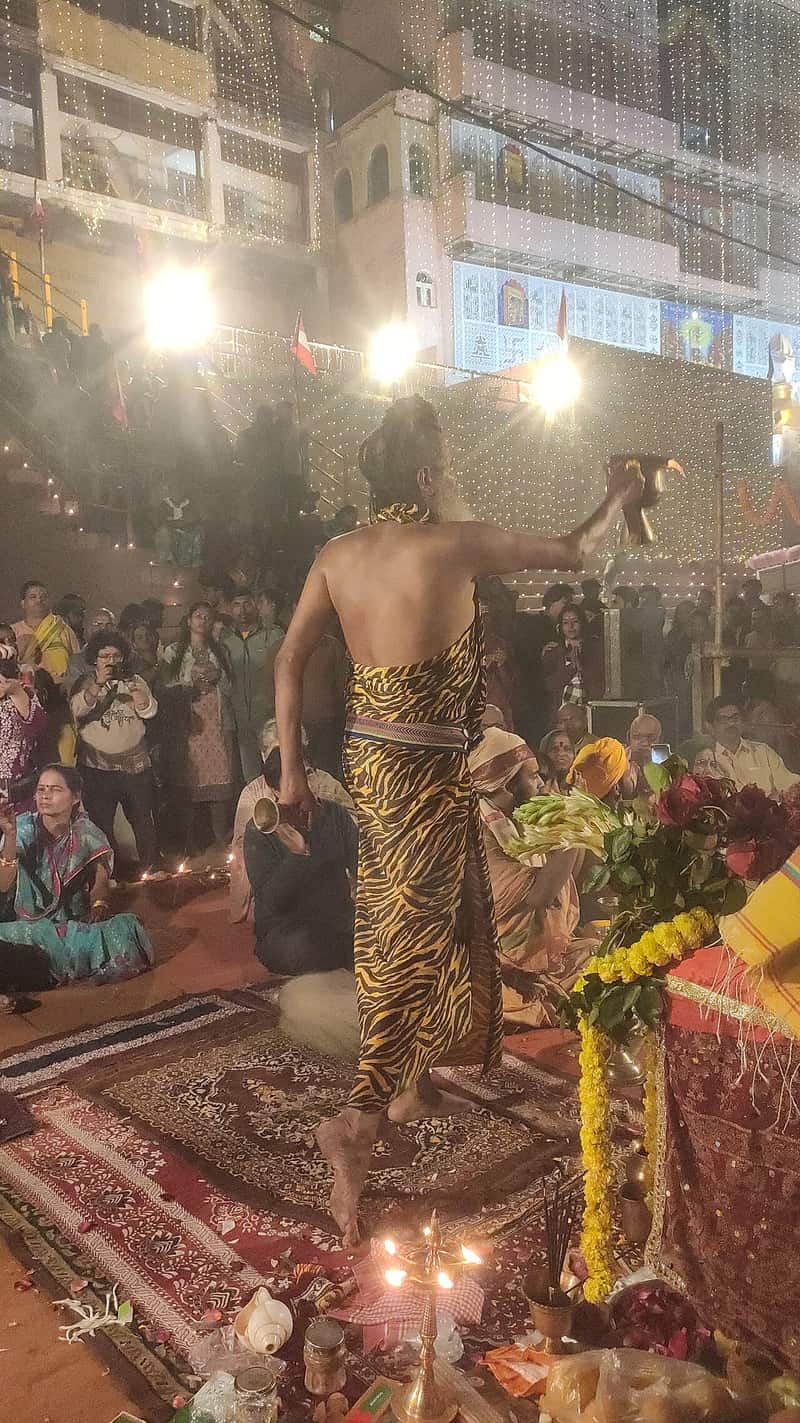 Oil lamps and marigold garlands arranged for a festival at Lali Ghat
