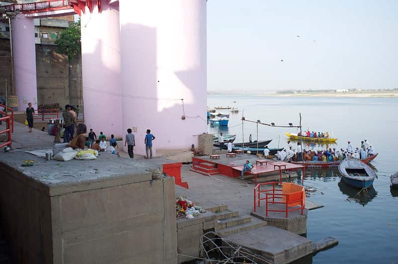Deep water and boats in front of Lalita Ghat at dusk