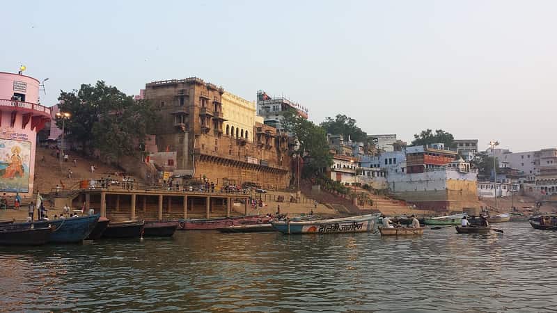 Boat on the Ganga approaching Man Mandir Ghat with the palace behind