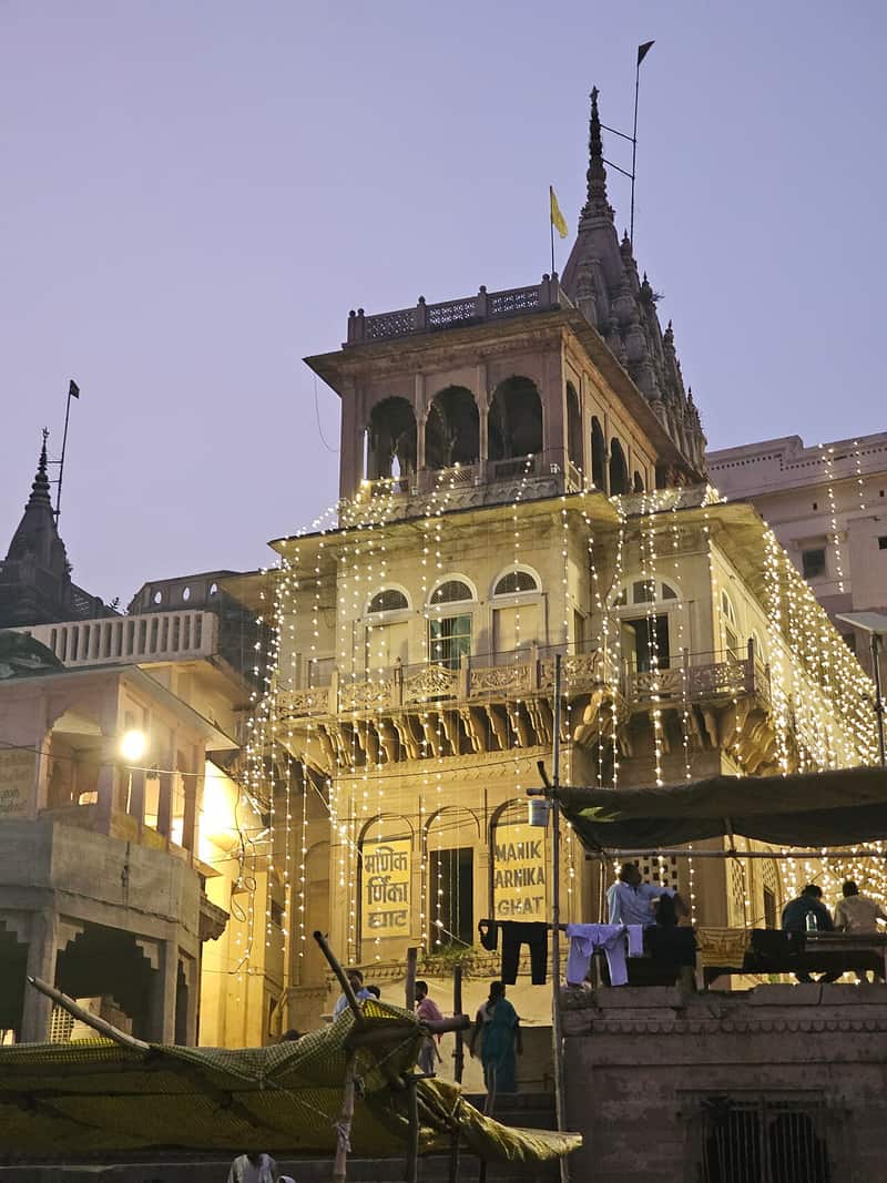 Visitors on the steps of Manikarnika Ghat