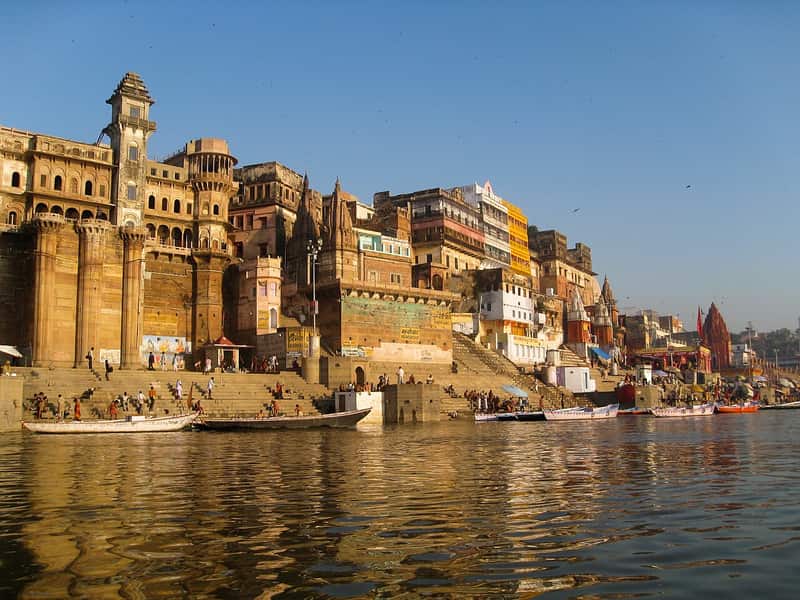 The Ganga flowing past Munshi Ghat with the sandy far shore and a lone boat