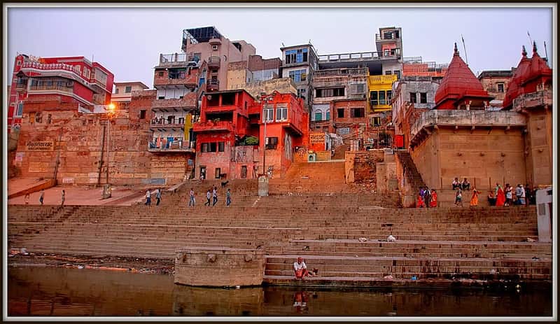 Morning bathers entering the Ganga from the ghat steps