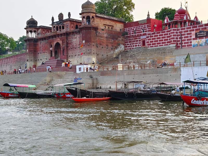 A procession of sadhus descending to the river at festival time