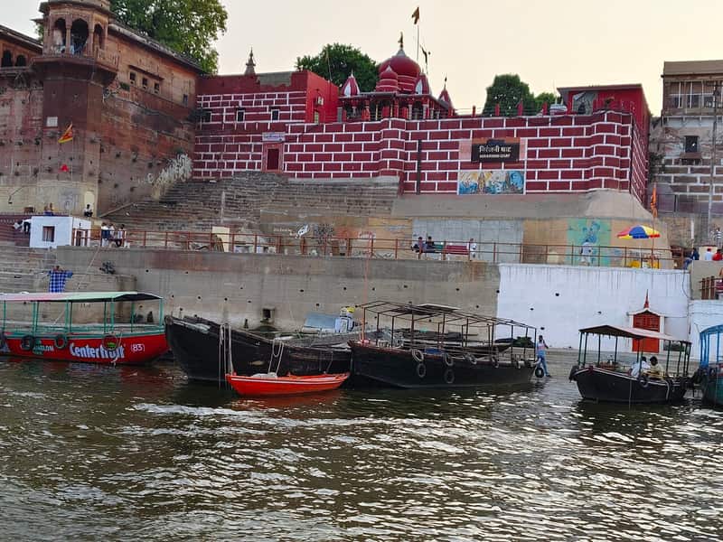 Pilgrims bathing on the steps of Niranjani Ghat at dawn