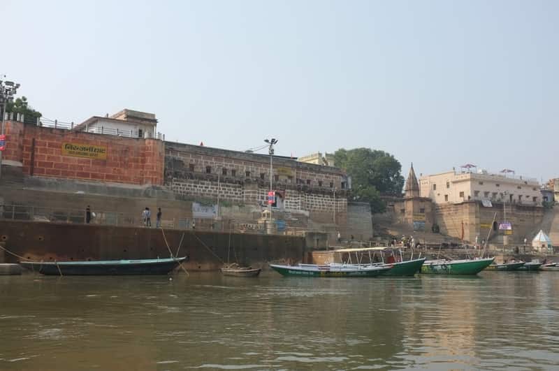 A traveller greeting a sadhu with folded hands at the ghat