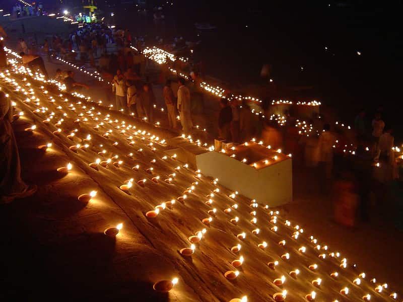 Pilgrims bathing in the sacred waters at Panchganga Ghat