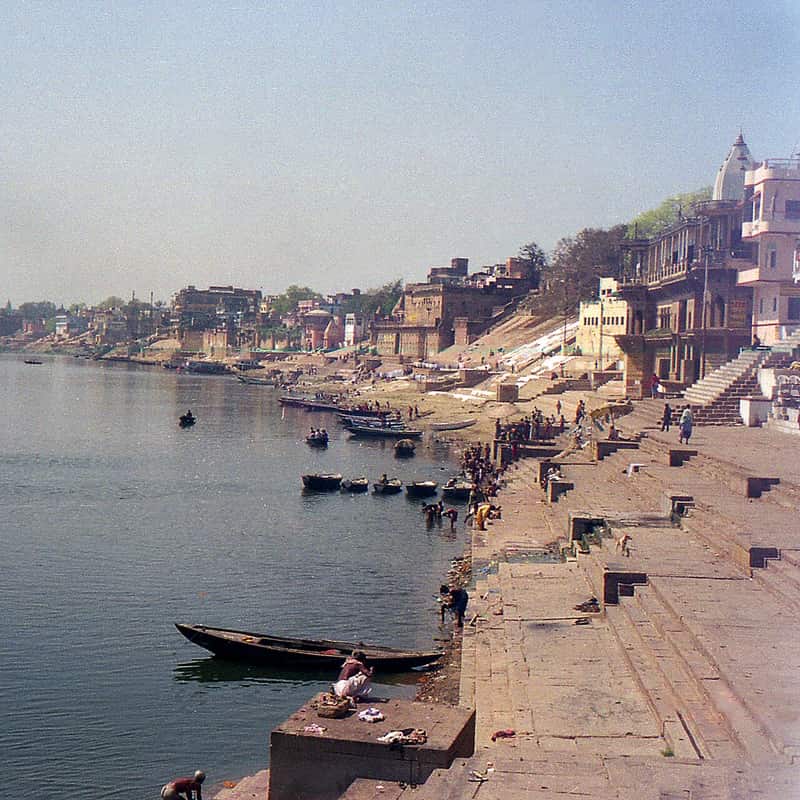 Priests performing a ritual at the water's edge