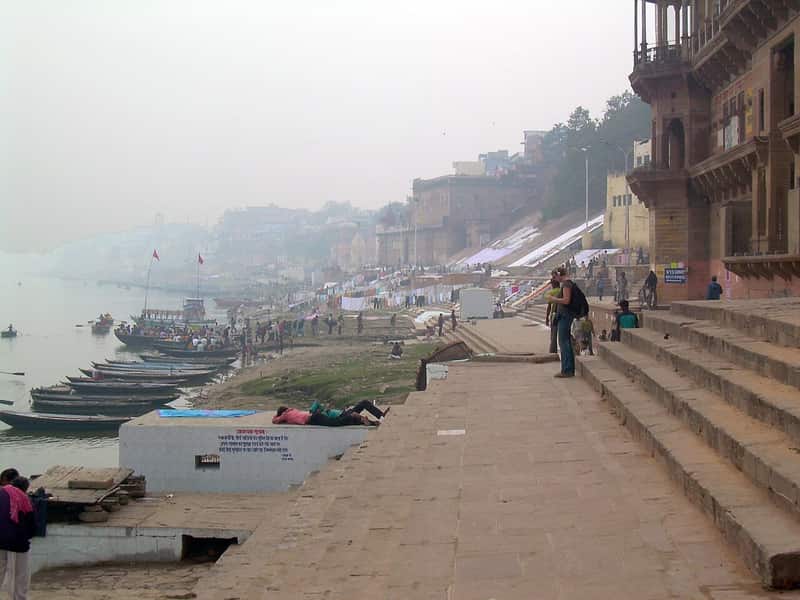 Oil lamps lit on the ghat during a festival evening