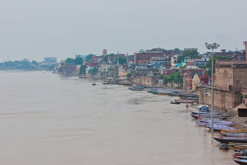 The broad stone steps of Raja Ghat descending to the Ganga