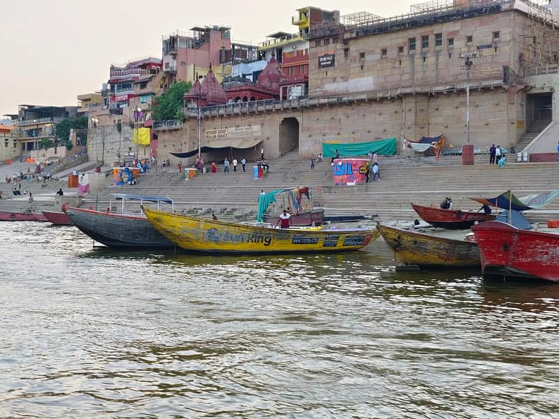 Boatmen with their boats moored at Raja Ghat