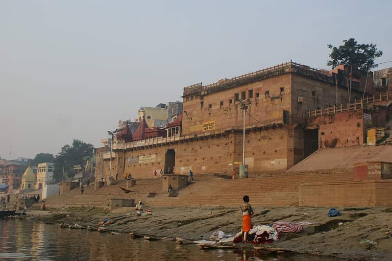 The wide Ganga flowing past Raja Ghat at dusk