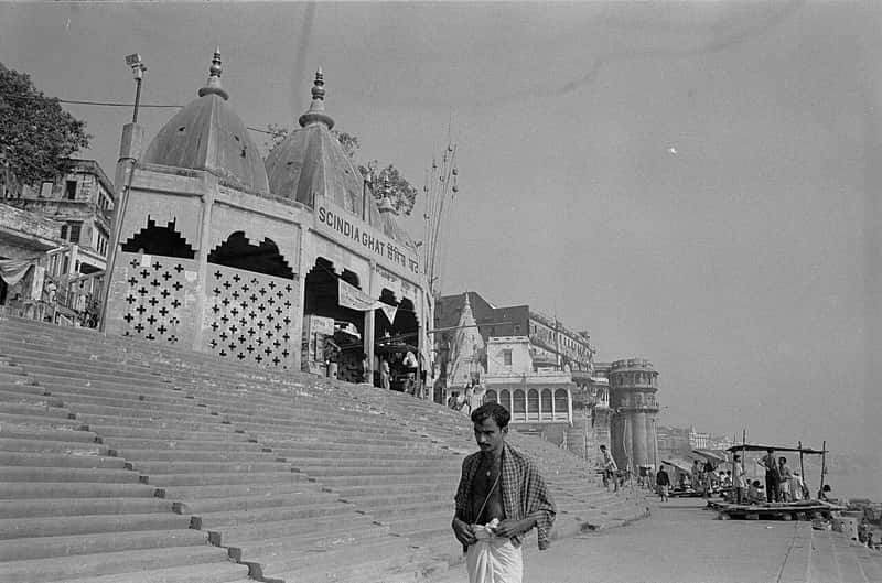 The half-submerged Shiva temple leaning into the river
