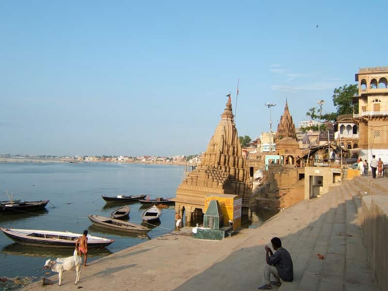 Stone terraces, arches and painted facades of Scindia Ghat