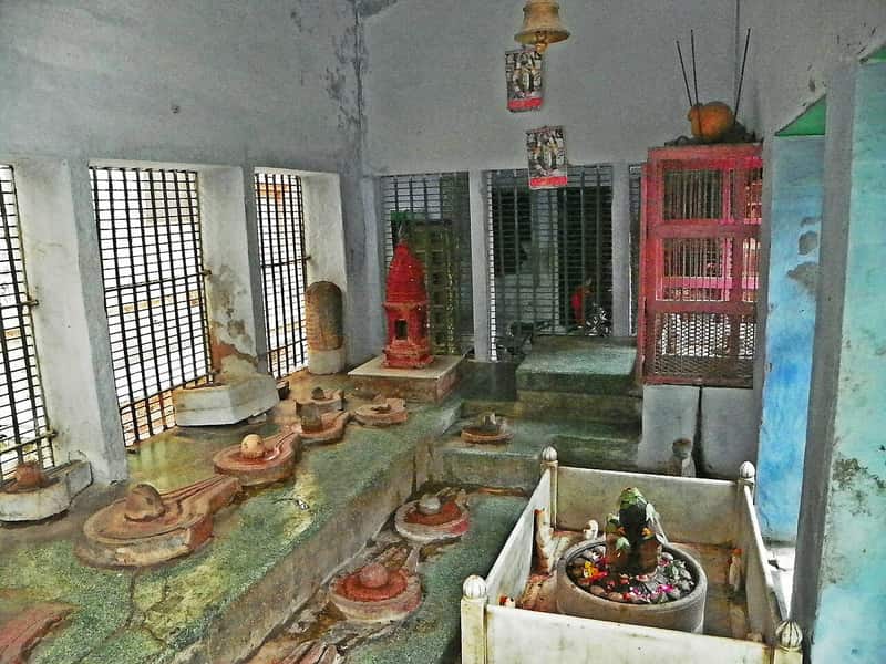 A priest performing rituals on the ghat steps