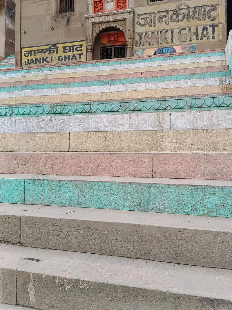 A copy of the Ramcharitmanas open on the steps of the ghat
